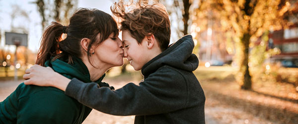 mom and son outside in the park